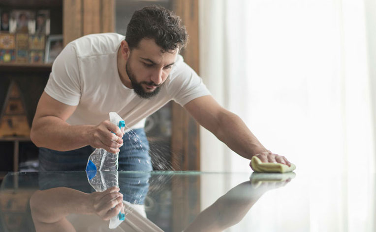Man cleaning table post-remodel